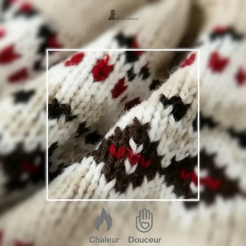 Die Hapka-Mütze zoomt auf beigefarbenen, schwarzen und roten Strick und unterstreicht die Wärme und Weichheit des Stoffes