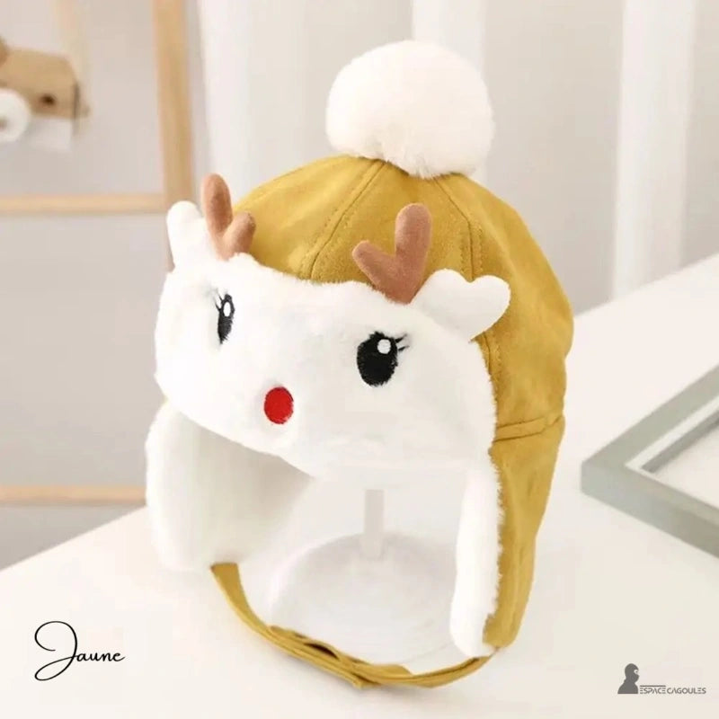 Yellow fleece reindeer children's hat with white pompom and brown ears, presented on a stand indoors