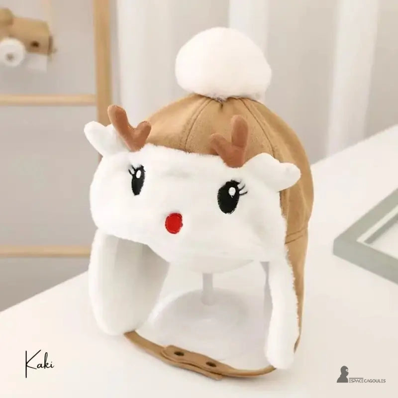 Khaki fleece reindeer children's hat with brown ears and white pompom, presented on a stand indoors