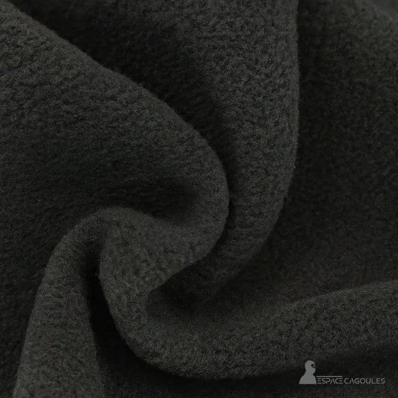 Hood Grey hood made of thick fleece fabric, close-up view of the textile showing the comfort and warmth of the material.