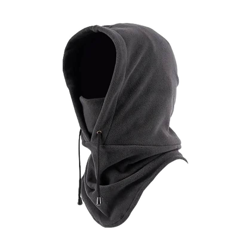 Grey hooded balaclava, seen from the side, designed to protect against the cold in winter. Its ergonomic design with wrap-around hood and elongated collar ensures optimal coverage of the face and neck. Side adjustment cord for a perfect fit.