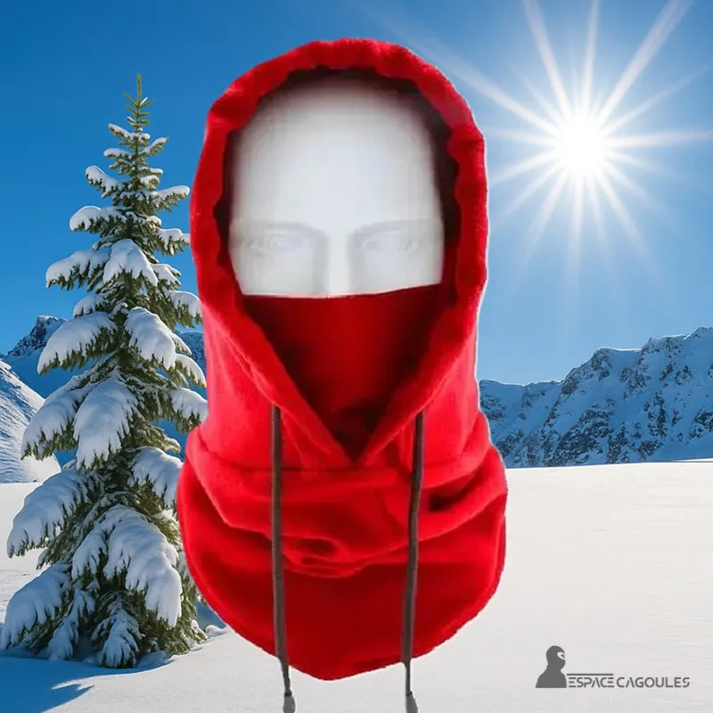 Balaclava Red fleece hood worn in the mountains, ideal protection against the cold outdoors, snowy background and sunny sky