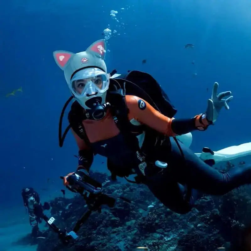 Scuba diver in a suit with a humorous blue diving hood and cat ears. Fun and functional accessory for a unique dive in deep waters.