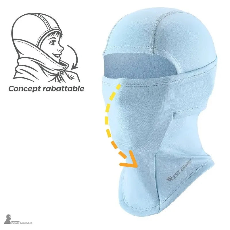 Cagoule de ski enfant SnowKid bleue présentée de profil avec flèche indiquant le concept rabattable de la protection faciale – Espace Cagoules