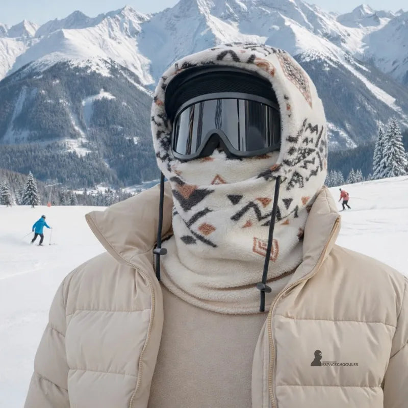 Fleece balaclava Polarhead worn on the ski slopes with goggles, front view in a snowy mountain environment – Space Balaclavas.
