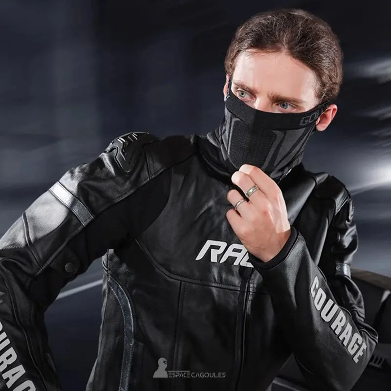 Balaclava black motorcycle mask worn by a biker in a black leather jacket, intense gaze