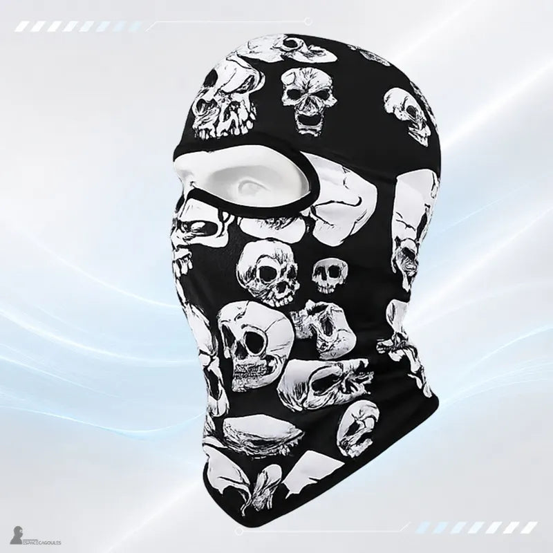 Motorcycle balaclava with a pattern of stacked white skulls viewed from the side on a light background - Espace Cagoules.