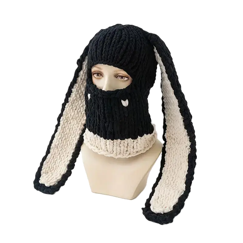 Black and White Rabbit Ears Balaclava on Mannequin â A mannequin presents a black knit balaclava with long, soft rabbit ears lined with white. Ideal for cold weather and winter sports.