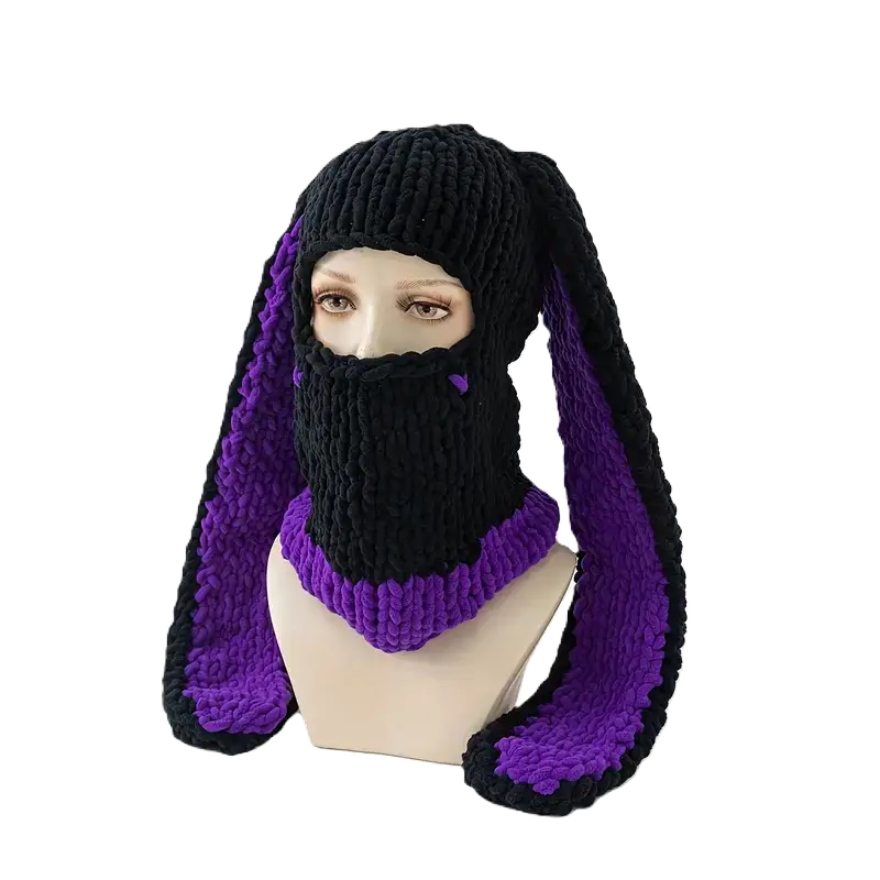 Black and purple bunny ears balaclava on mannequin â A black knitted balaclava with purple fleece bunny ears and a matching collar. Presented on a mannequin, ideal for an original and trendy style.