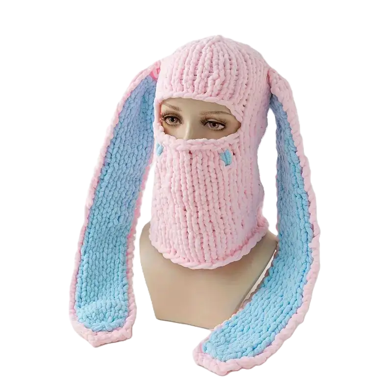 Pink and Blue Bunny Ears Balaclava on Mannequin â A pink wool balaclava beanie with long blue faux fur bunny ears. A cute and warm accessory for winter.