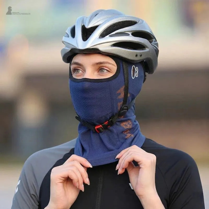 Woman wearing a cycling balaclava under a helmet with neck adjustment and front view - Balaclava Space