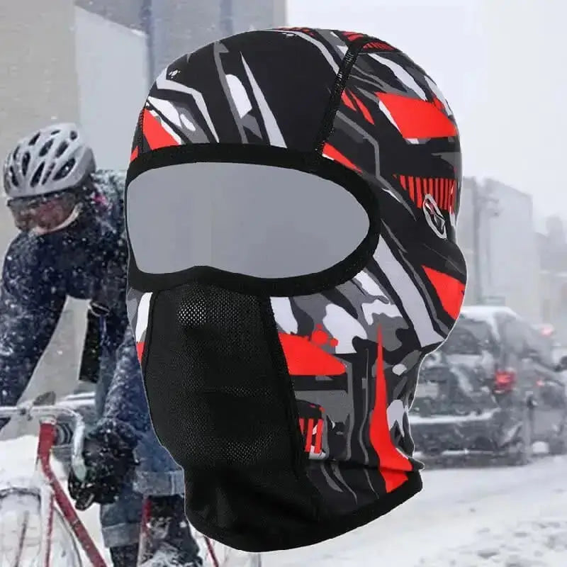 Balaclava for cycling in winter, red, black and grey design with abstract patterns, equipped with a breathable nose zone and an opening for glasses, ideal for facing snowy conditions.