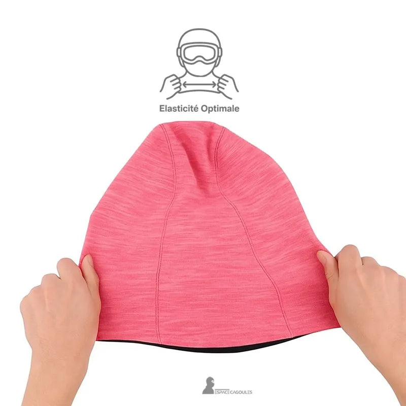 Rosa skidbalaclava för flickor som hålls med båda händerna för att illustrera dess optimala elasticitet och mjuka textur i stretchtyg – Espace Cagoules