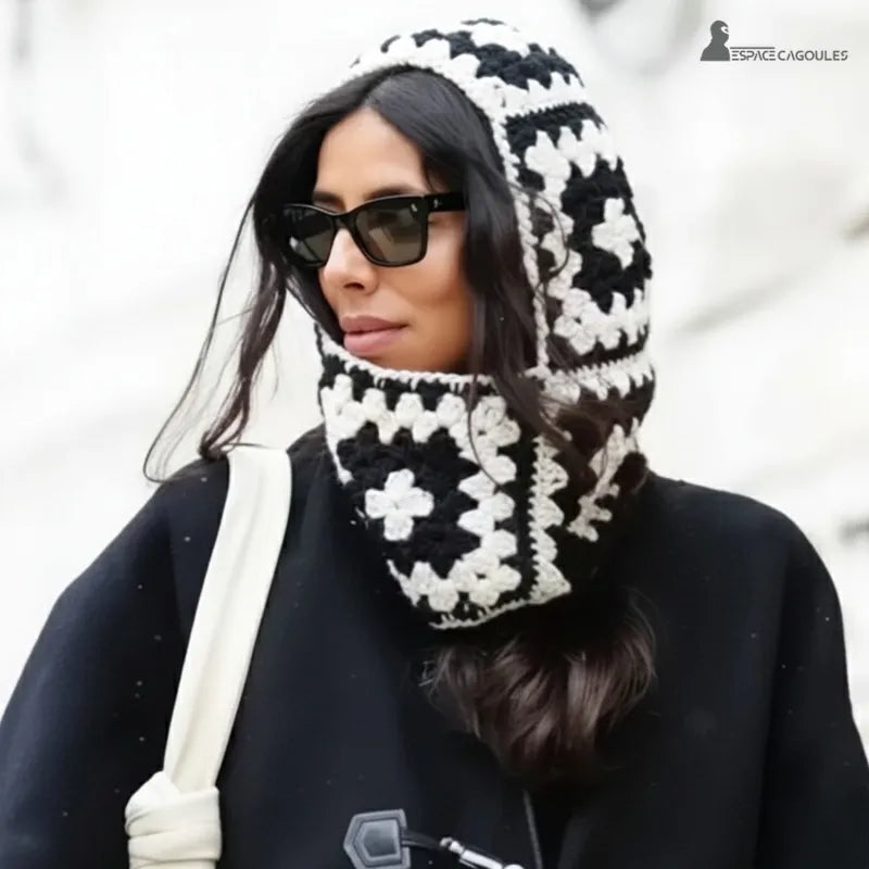 Black and white crochet women's balaclava worn in the city with elegant coat and sunglasses