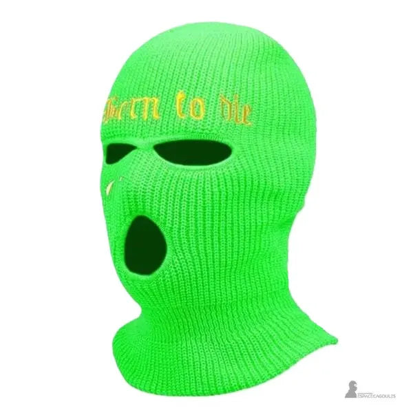 Cagoule tricot verte fluo à trois trous avec broderie Born to die mise en avant sur fond neutre