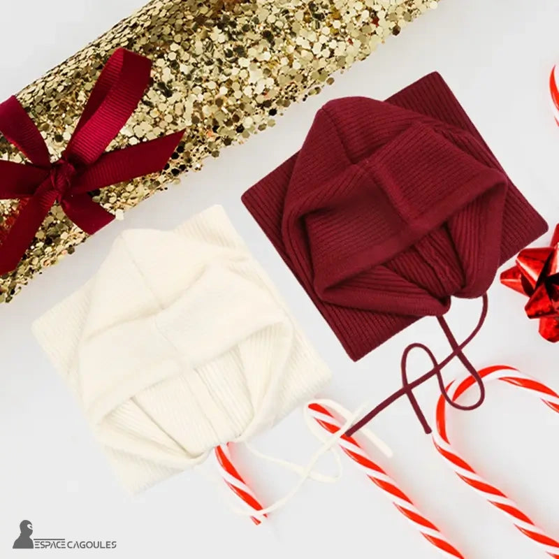 Women's white and red burgundy knitted balaclava folded and decorated for Christmas gift with sugar canes and gold ribbon