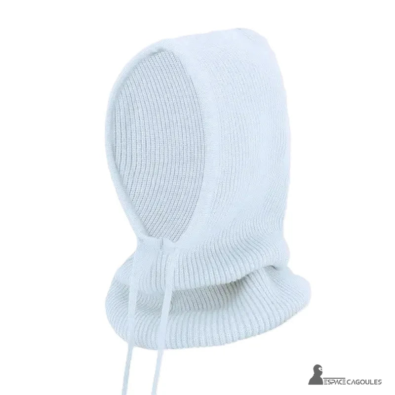 White woman knitted balaclava posed alone on white background, side view