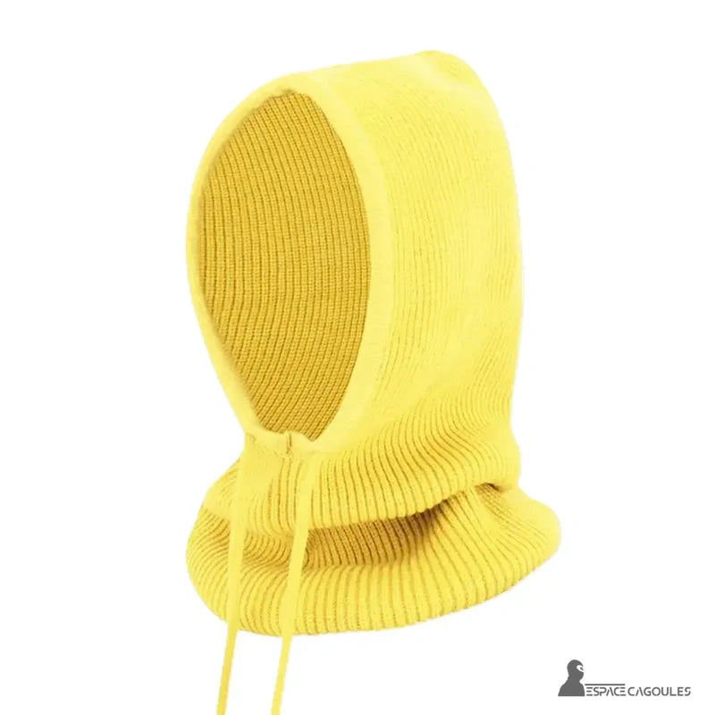Bright yellow woman knitted balaclava posed alone on white background, side view