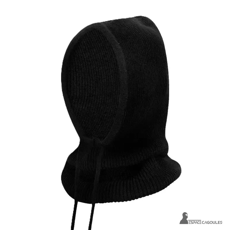 Black woman knitted balaclava posed alone on white background, side view