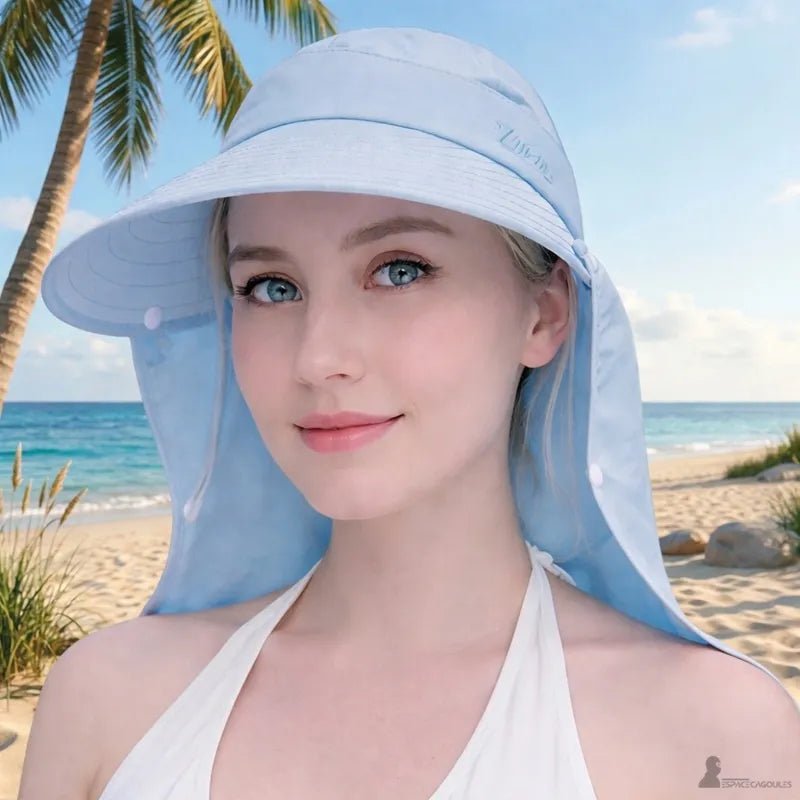 Blue women's safari hat worn by a woman walking on a sunny beach - Cagoules Space