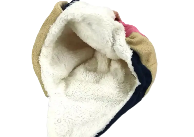 Close-up view of the inside of a child aviator hat, showing the warm white fleece lining.
