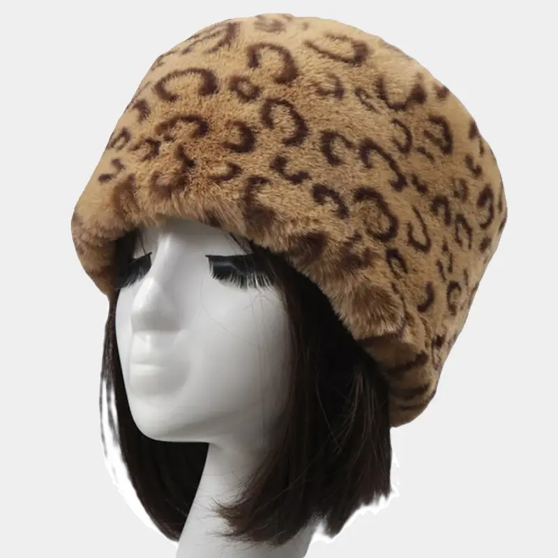 Leopard hat in soft faux fur, displaying distinctive feline motifs. Perfect winter accessory for outdoor outings.