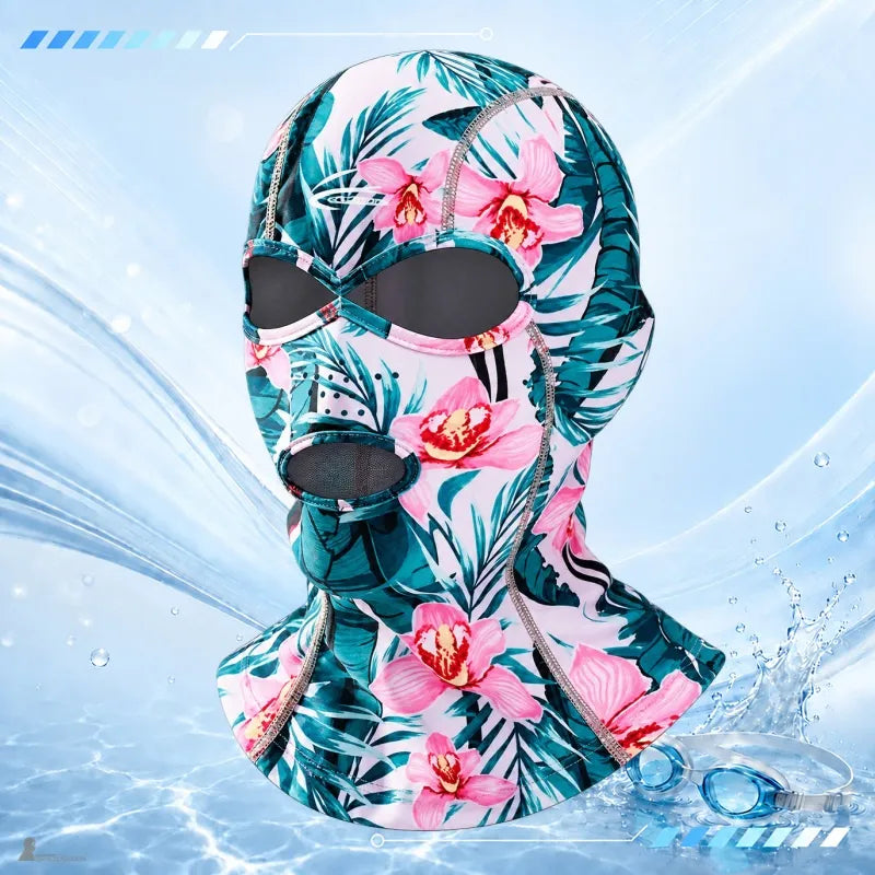 UPF 40+ Anti-UV-Sturmhaube mit tropischem Muster, grünem Laub und rosa Blüten, umrandeten Augen- und Mundöffnungen sowie Halsbedeckung – Espace Cagoules