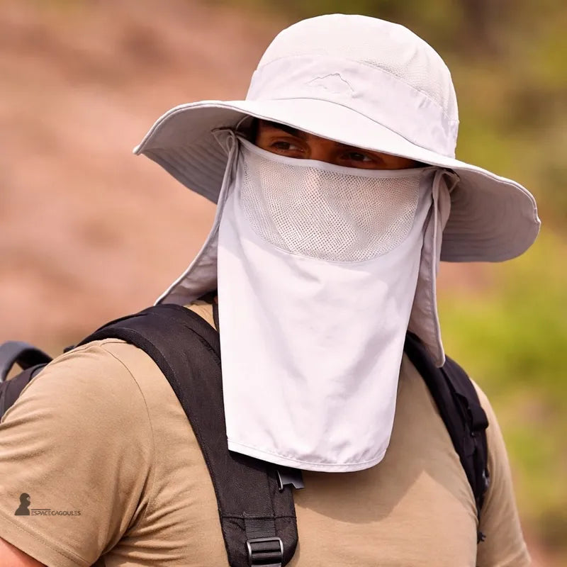 Beige sun protection hood worn by a man outdoors with a face mask covering and a backpack - Hood Space