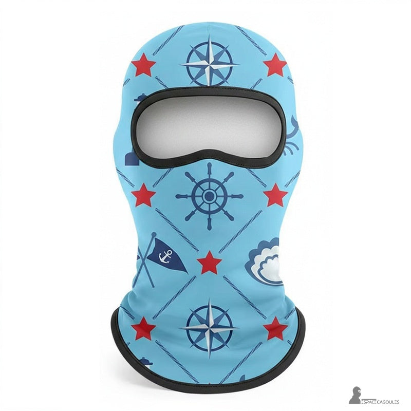 Tunn balaclava under hjälm för barn i polyester och spandex, fodrad med fleece, balaclava-form med en öppning, sett framifrån platt med blå nautiska mönster – Utrymme för balaclavas