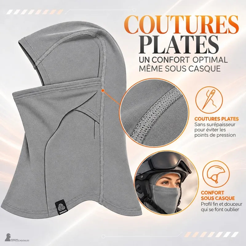 Gros plan sur les coutures plates de la cagoule laine mérinos Ovis grise et skieuse la portant sous son casque - Espace Cagoules