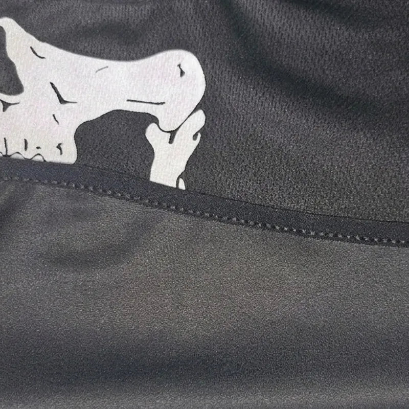 Military Hood Skull Macro made of black fabric with visible stitching and a portion of the white skull pattern showing the texture of the textile – Hood Space