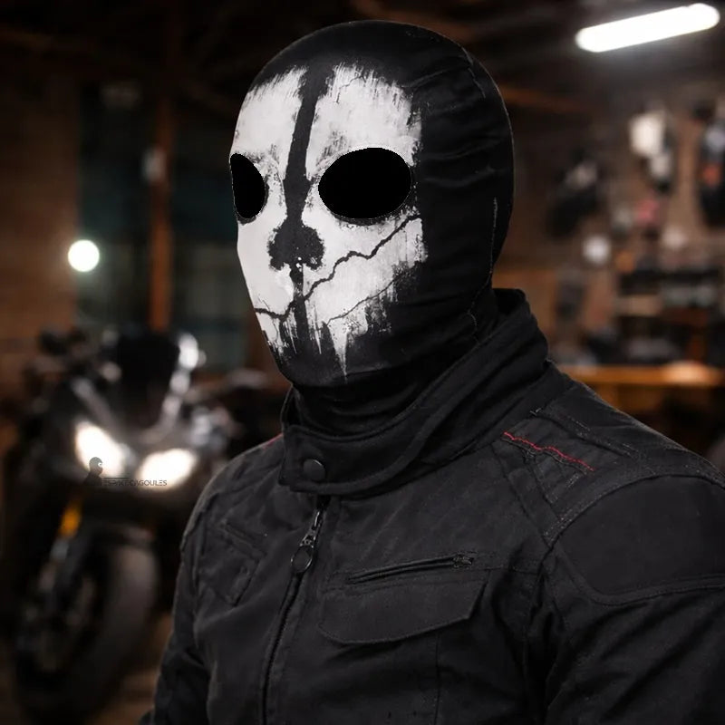 Black microfiber motorcycle balaclava with 2 holes, featuring a white skull design, viewed in a three-quarters angle in a motorcycle garage - Espace Cagoules.