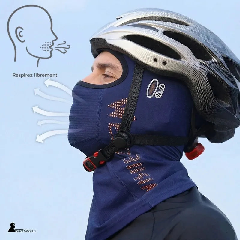 Profile view of a man with a hood under a helmet showing airflow exiting at the mouth - Hood Space