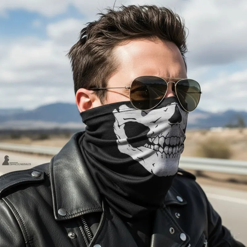 Balaclava neck gaiter skull worn by a man in a black jacket and sunglasses on a clear road in the background - Space Balaclavas.