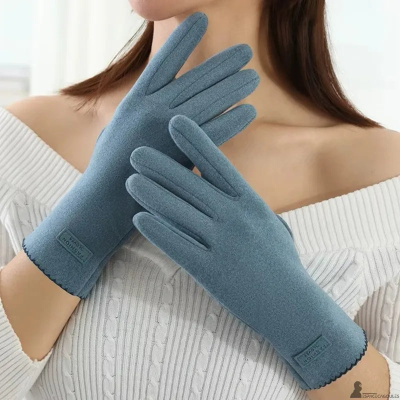 Warm dralon gloves for women in blue, made of soft textile, long shape covering the wrist, worn view facing model indoors - Cagoules Space.